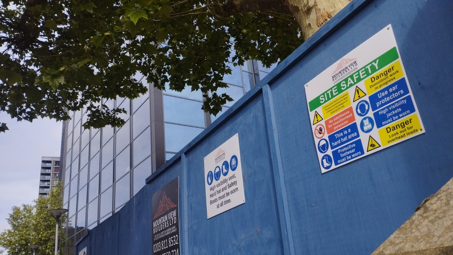 Angled view of 43 Friends Road hoarding and MVB safety signage