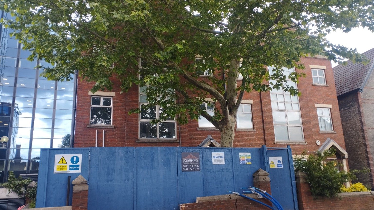 43 Friends Road exterior with MVB hoarding and live site signage